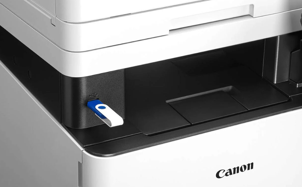 USB flash drive plugged into the front USB port of a Canon printer