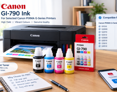 Canon GI-790 ink bottles and a retail box in front of a black ink-tank printer printing a colour photo